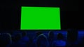 In the Movie Theater Captivated Audience Watching New Blockbuster Film on Mock-up Green Screen. Pe Royalty Free Stock Photo