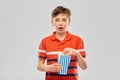 Boy eating popcorn Royalty Free Stock Photo