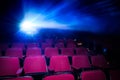 Movie Theater with empty seats and projector Royalty Free Stock Photo