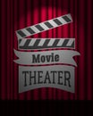 Movie theater logo on dark red curtain scene gracefully. Royalty Free Stock Photo