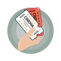 Vector image icons. Movie tickets. Two tickets to the cinema in his hand. Cartoon style or flat