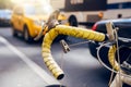 Moving by bicycle in the city. Bike is alternative, ecological and fast city transport. Bicycle wheel against city bus taxi Royalty Free Stock Photo