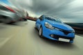 Moving blue car Royalty Free Stock Photo