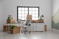 Moving boxes and furniture in office Royalty Free Stock Photo