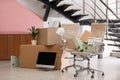 Moving boxes and furniture in office Royalty Free Stock Photo