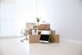 Moving boxes and furniture in office Royalty Free Stock Photo
