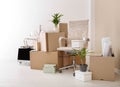 Moving boxes and furniture in office Royalty Free Stock Photo
