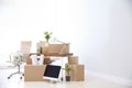 Moving boxes and furniture in new office Royalty Free Stock Photo