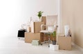 Moving boxes and furniture in new office Royalty Free Stock Photo