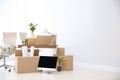 Moving boxes and furniture in new office. Royalty Free Stock Photo
