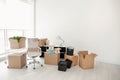 Moving boxes and furniture in office Royalty Free Stock Photo