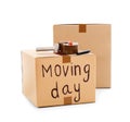 Moving boxes, marker and adhesive tape dispenser Royalty Free Stock Photo