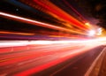 Moving cars with fast blurred trail of headlights Royalty Free Stock Photo