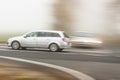 Moving cars on foggy weather in country road - Pol Royalty Free Stock Photo