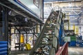 Moving conveyor transporter on Modern waste recycling processing plant. Separate and sorting garbage collection. Recycling and Royalty Free Stock Photo