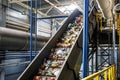 Moving conveyor transporter on Modern waste recycling processing plant. Separate and sorting garbage collection. Recycling and Royalty Free Stock Photo