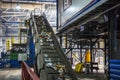 Moving conveyor transporter on Modern waste recycling processing plant. Separate and sorting garbage collection. Recycling and Royalty Free Stock Photo