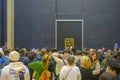 Moving crowd capturing selfie, wefie in front of Mona Lisa portrait by the Italian artist Leonardo da Vinci Royalty Free Stock Photo