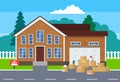 Moving day concept.cardoard boxes near house for sale Royalty Free Stock Photo
