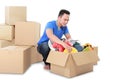 Moving day. man with cardboard box Royalty Free Stock Photo