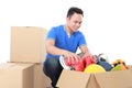 Moving day. man with cardboard box Royalty Free Stock Photo