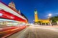 Moving Double Decker Bus under Houses of Parliament and Big Ben. Royalty Free Stock Photo