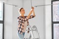 woman changing light bulb at new home Royalty Free Stock Photo