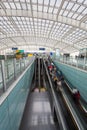 Moving escalator within the modern airport hall Royalty Free Stock Photo