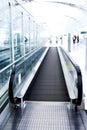 Moving escalator in the office hall Royalty Free Stock Photo