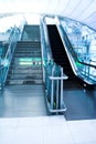 Moving escalator in the office hall Royalty Free Stock Photo