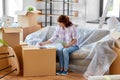 asian woman moving to new home and counting money Royalty Free Stock Photo