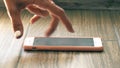 Female fingers on a cell phone imitate treadmill runner