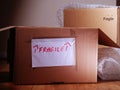 Moving fragile items with cardboard boxes and bubble wrap Royalty Free Stock Photo