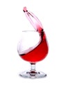 moving a glass of red wine on a white background Royalty Free Stock Photo