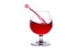 moving a glass of red wine on a white background Royalty Free Stock Photo