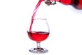 moving a glass of red wine on a white background Royalty Free Stock Photo