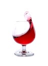 moving a glass of red wine on a white background Royalty Free Stock Photo