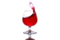 moving a glass of red wine on a white background Royalty Free Stock Photo