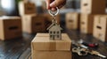 Moving house, Key house keychain in new home. Buy or rent real estate concept Royalty Free Stock Photo