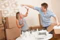 Moving house: Young couple having fun