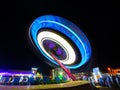 Moving light from ferris wheel at night Royalty Free Stock Photo