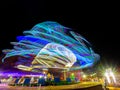 Moving light from ferris wheel at night Royalty Free Stock Photo