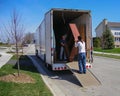Moving men unloading a moving truck