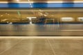 Moving Metro train on a station background.