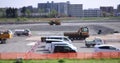 Moving miniature cranes at the under construction daytime tiltshift