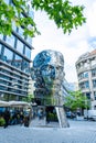 Moving monument head Franz Kafka in the center of Prague. art object chromed shiny sculpture of 64 plates