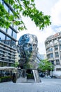 Moving monument head Franz Kafka in the center of Prague. art object chromed shiny sculpture of 64 plates