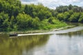 Moving on a motor boat on a river with forested coasts Royalty Free Stock Photo