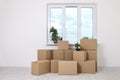 Moving into a new apartment. Move lots of cardboard boxes in an empty new apartment. Royalty Free Stock Photo