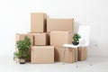 Moving into a new apartment. Move lots of cardboard boxes in an empty new apartment. Royalty Free Stock Photo